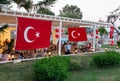 Turkish flags in hotel restaurant. Hotel event Turkish night show with National food, music and entertainment for tourist guests Royalty Free Stock Photo