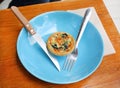 Turkish flat bread with cheese and spinach topping served on a plate. Royalty Free Stock Photo