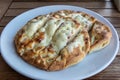 Turkish flat bread covered with cheese