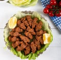 Turkish Food Cig Kofte with lemon, lettuce and parsley