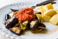 Turkish Food Kizartma / Fried Aubergine or Eggplant Slices with Tomato Paste Salsa Sauce and Cube Potatoes. Royalty Free Stock Photo