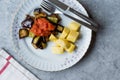 Turkish Food Kizartma / Fried Aubergine or Eggplant Slices with Tomato Paste Salsa Sauce and Cube Potatoes. Royalty Free Stock Photo