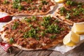 Turkish Food: lahmacun closeup on a table. Horizontal Royalty Free Stock Photo