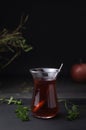 Turkish Fruit red tea in glass cup, on black background. summer season. concept of tea time and summer. Royalty Free Stock Photo