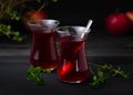 Turkish Fruit red tea in glass cup, on black background. summer season. concept of tea time and summer. Royalty Free Stock Photo