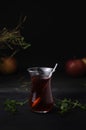 Turkish Fruit red tea in glass cup, on black background. summer season. concept of tea time and summer. Royalty Free Stock Photo