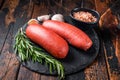 Turkish halal Sucuk meat sausage. Wooden background. Top view Royalty Free Stock Photo