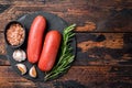 Turkish halal Sucuk meat sausage. Wooden background. Top view. Copy space Royalty Free Stock Photo