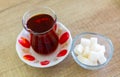 Turkish hot black tea served in traditional glass with sugar cubes Royalty Free Stock Photo