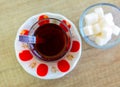 Turkish hot black tea served in traditional glass with sugar cubes Royalty Free Stock Photo
