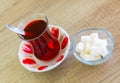 Turkish hot black tea served in traditional glass with sugar cubes Royalty Free Stock Photo