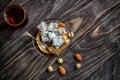 Turkish joys with different nuts is a glass of tea and a spoon. Eastern sweets. Traditional Turkish delight Rahat lokum on a Royalty Free Stock Photo