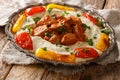 Turkish Kebab Ali Nazik Recipe cooked lamb in red sauce with mashed eggplant closeup in the plate. Horizontal Royalty Free Stock Photo
