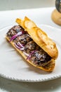 Turkish Kofte Ekmek / Meatball Sandwich with Red Onions. Traditional Fast Food from Turkey