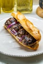 Turkish Kofte Ekmek / Meatball Sandwich with Red Onions. Traditional Fast Food from Turkey