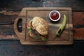 Meatball Sandwich with tomatoes, onion and green pepper on rustic wooden background Royalty Free Stock Photo