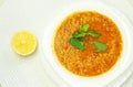 Turkish lentil soup on a plate with mint and lemon Royalty Free Stock Photo