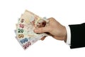 turkish lira in businessman's hand