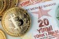 Turkish Lira currency banknotes with Bitcoin BTC cryptocurrency coins.