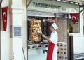 Turkish man cuts chicken doner kebap