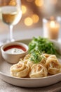 Turkish manti dumplings presented with yogurt and savory sauce in an elegant dining setting Royalty Free Stock Photo