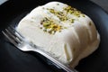 Turkish Maras Vanilla Ice Cream with Pistachio Powder Served Portion in Black Plate. Royalty Free Stock Photo