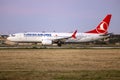 Turkish 737 MAX taking off in the sunset Royalty Free Stock Photo