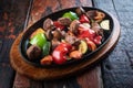 Turkish meat Et Sote on rustic woogen table Royalty Free Stock Photo