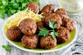 Turkish meatballs kuru kofte garnished with fried potato