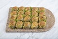 Turkish Midye Baklava Mussel Shape Baklava with green pistachio Powder and Butter Cream. Famous Turkish Gaziantep baklava