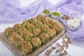 Turkish Midye Baklava Mussel Shape Baklava with green pistachio Powder and Butter Cream. Famous Turkish Gaziantep baklava