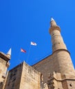 turkish and north cyprus flying over minarets of Selimiye Mosque formerly the cathedral of Saint Sophia in nicosia cyprus against Royalty Free Stock Photo