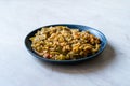 Turkish Olive Oil Food Green Peas / Fasulye Diblesi or Ayse Kadin Dible with Bulgur / Bulghur Rice served in Plate Royalty Free Stock Photo