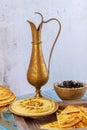 Turkish party table with hummus, bread and copper jug Royalty Free Stock Photo