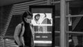 Turkish passengers walk in front of a billboard about commemoration day of Ataturk Royalty Free Stock Photo