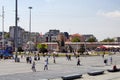 Turkish people walk at Taksim Square