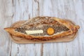 Turkish Pide with egg and minced meat. / Karadeniz Pidesi