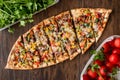 Turkish Pide with meat and vegetables. Royalty Free Stock Photo