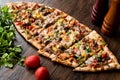 Turkish Pide with meat and vegetables. Royalty Free Stock Photo