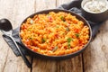 Turkish pilaf from bulgur with vegetables and spices close-up in a bowl. Horizontal Royalty Free Stock Photo