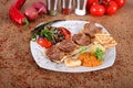 A big Turkish pirzola with fresh peppercorns fresh tomatoes and vegetables