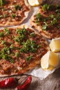 Turkish pizza with meat - lahmacun macro on the table. vertical