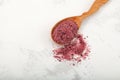Turkish powdered fruit tea. Instant drink in wooden spoon, close-up. Selective focus, copy space Royalty Free Stock Photo