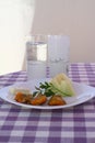 Turkish raki concept. Melon and cheese with stuffed zucchini blossoms. A vintage record player plays in the background.