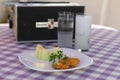 Turkish raki concept. Melon and cheese with stuffed zucchini blossoms. A vintage record player plays in the background.