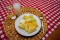 Turkish raki and melon on red white striped table cloth Royalty Free Stock Photo
