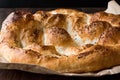 Turkish Ramadan Bread - Ramazan Pidesi on wooden surface / Pide