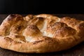 Turkish Ramadan Bread - Ramazan Pidesi on wooden surface / Pide