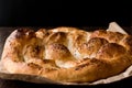 Turkish Ramadan Bread - Ramazan Pidesi on wooden surface / Pide