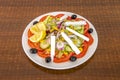 Turkish salad with lots of tomato, red onion, yellow sweet corn, fresh cheese, chopped lemon, pitted black olives, iceberg lettuce Royalty Free Stock Photo